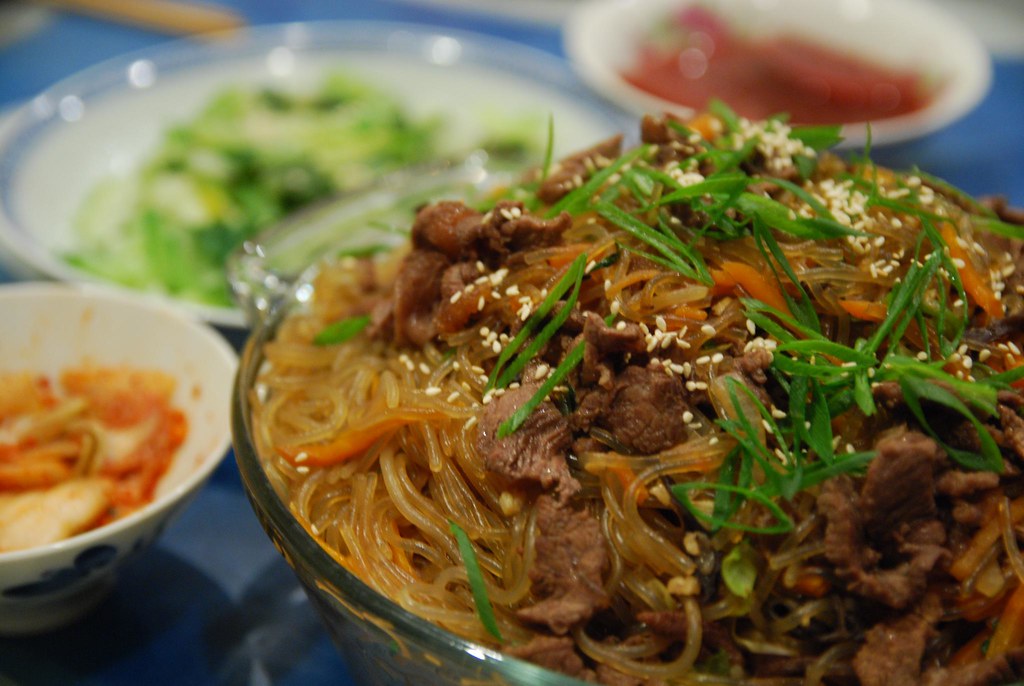 chop chae noodles with beef and vegetable topping