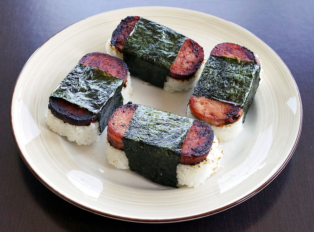 four spam musubi on a plate