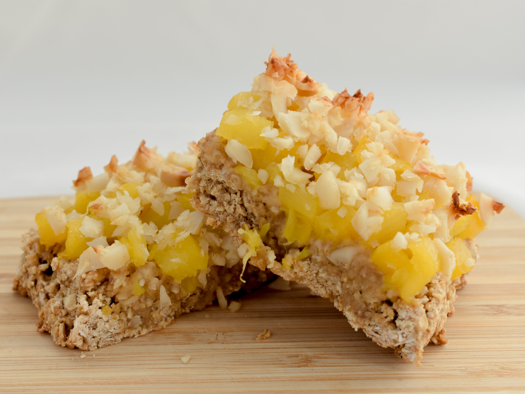 pineapple oat breakfast squares on wood cutting board