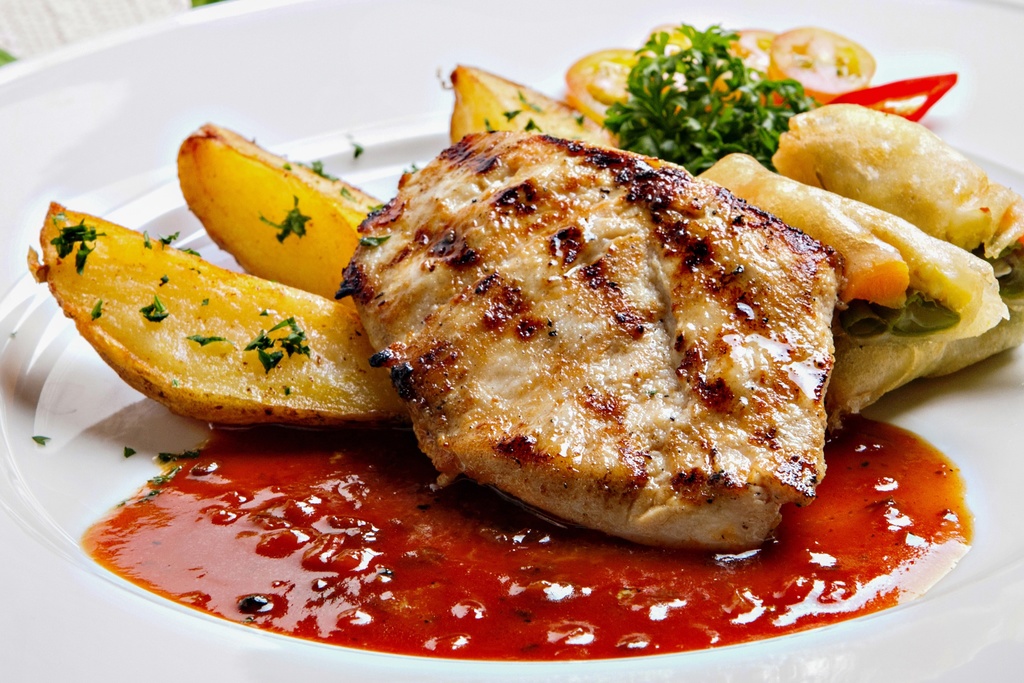 pork center loin chops with sauce and sides