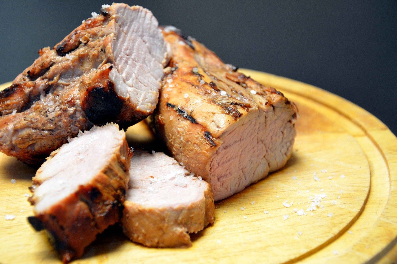 sliced pork loin on cutting board