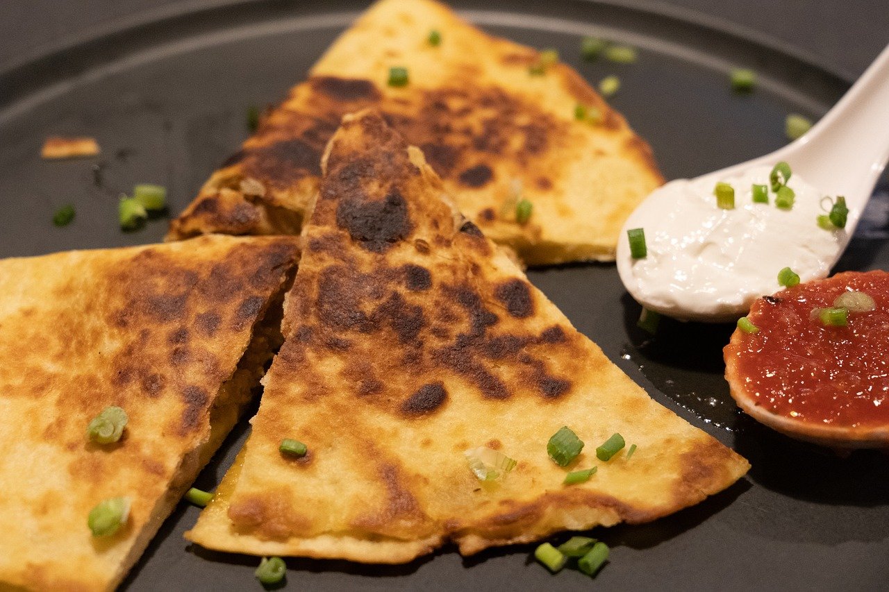 cheese quesadilla with salsa and sour cream