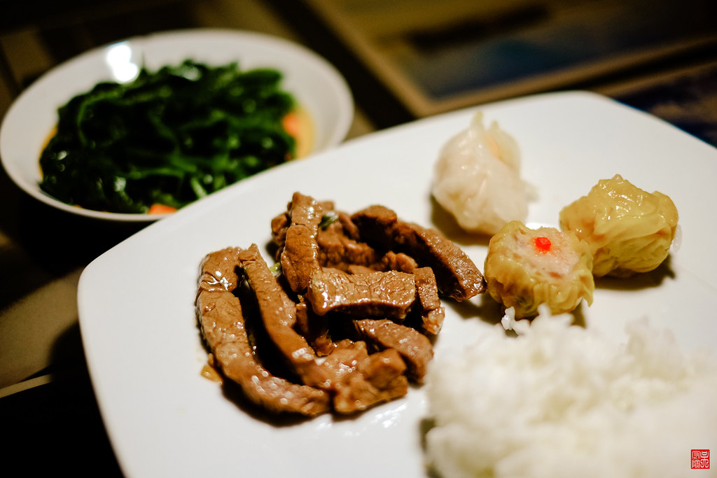 teriyaki beef with pork hash on a plate