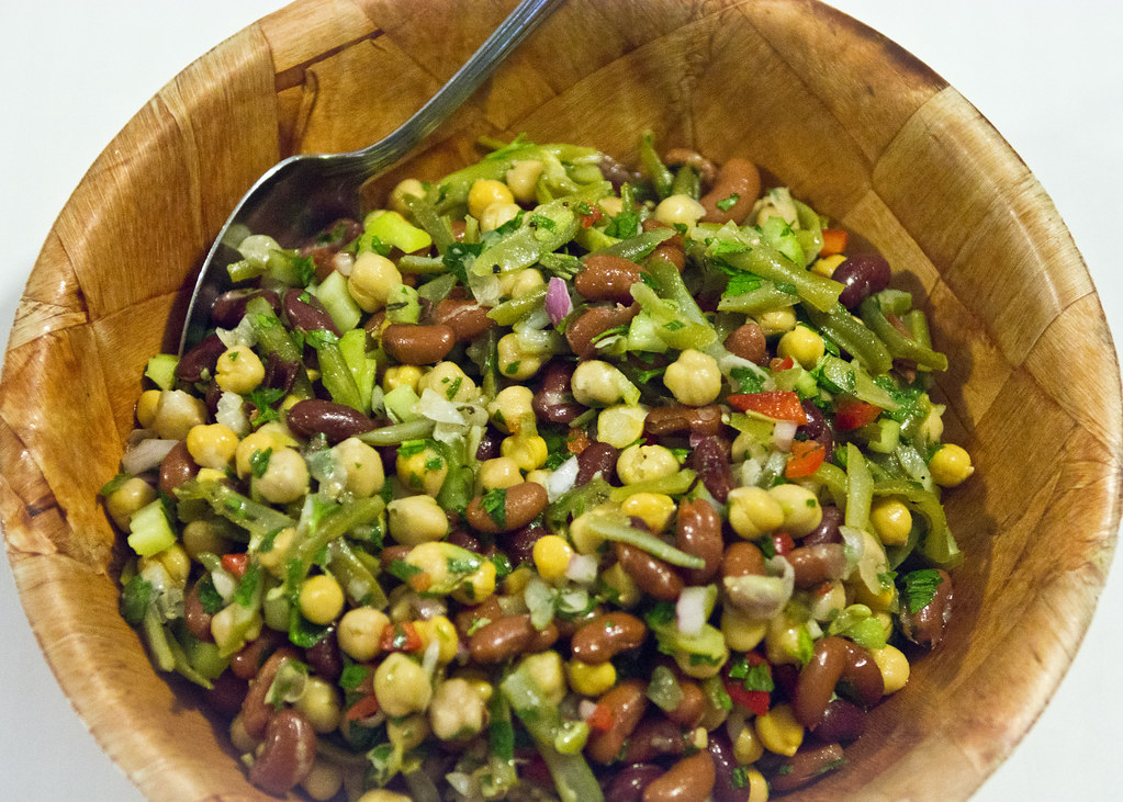 three bean salad in a wooden bowl