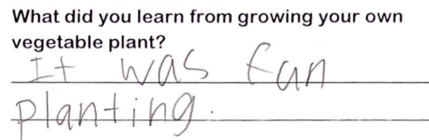Student writing "It was fun planting."