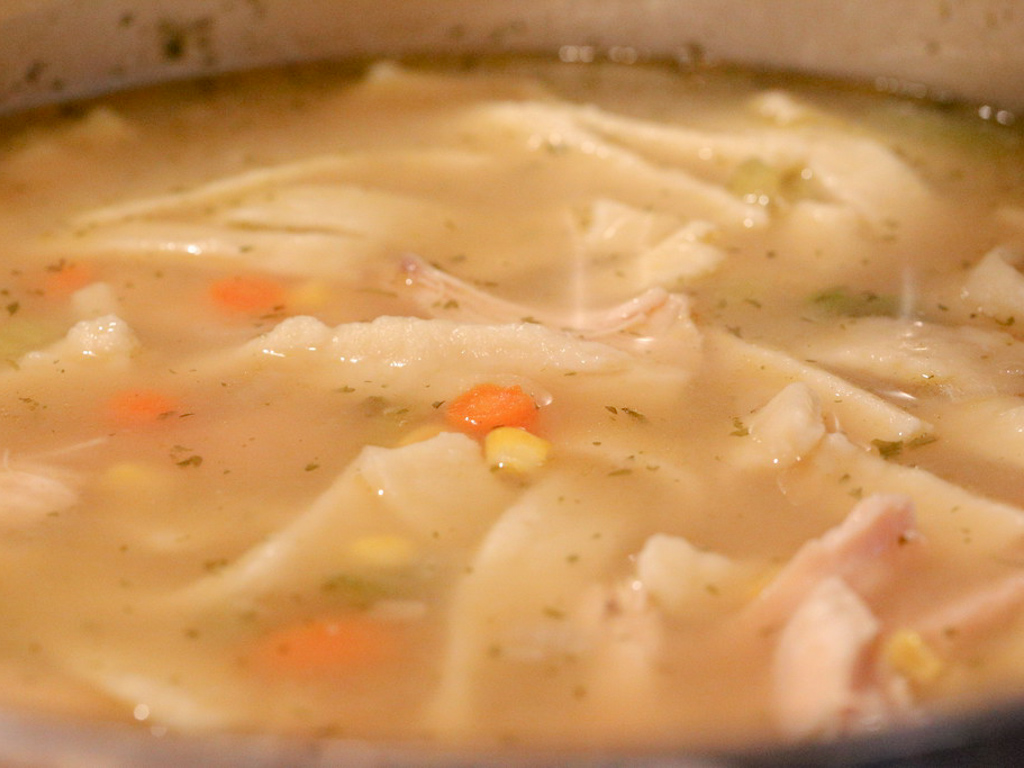Chicken noodle soup with carrots and corn