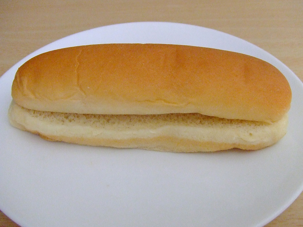 hot dog bun on a plate