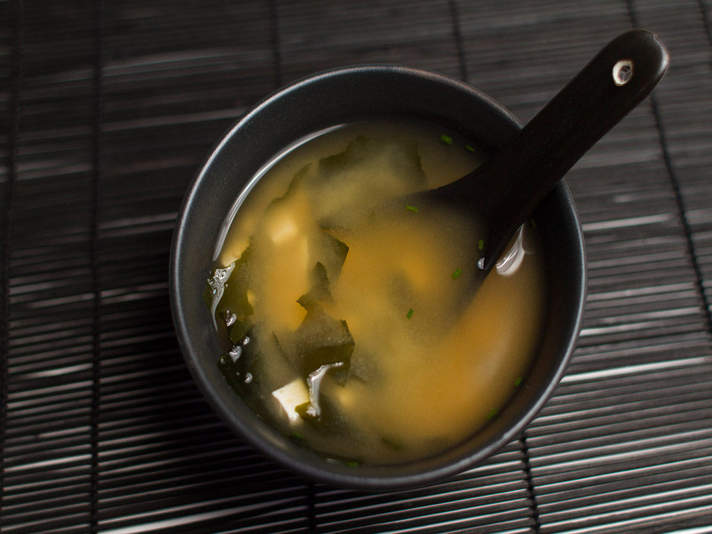 Miso soup in a bowl with spoon