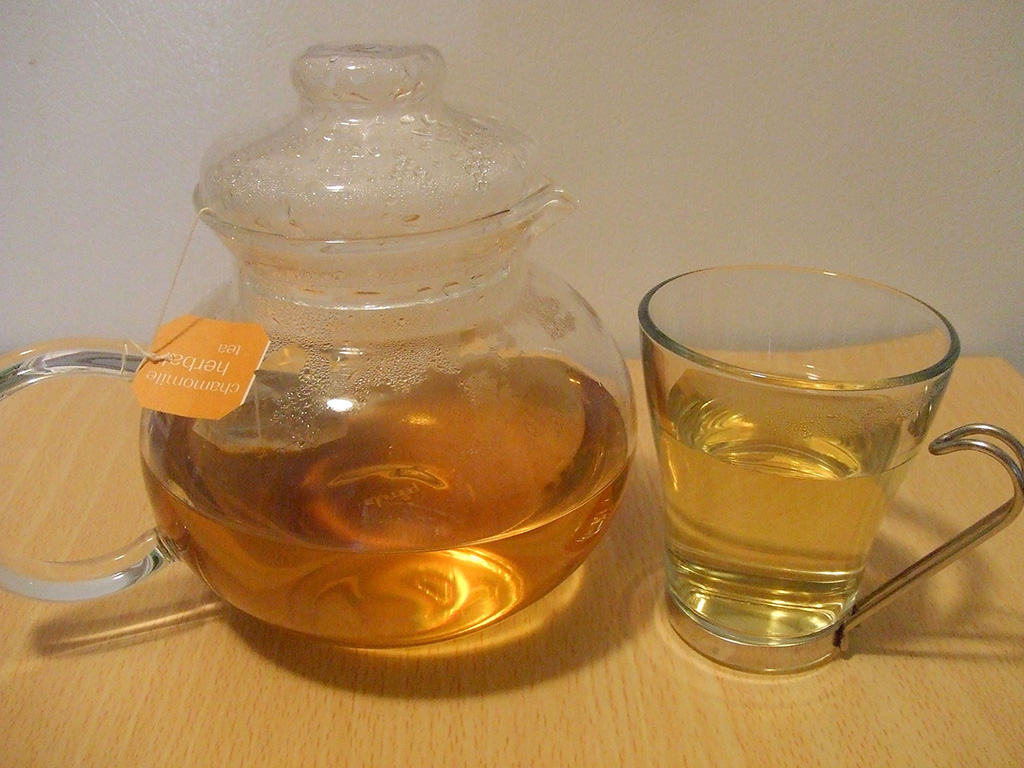herbal tea in pot and glass