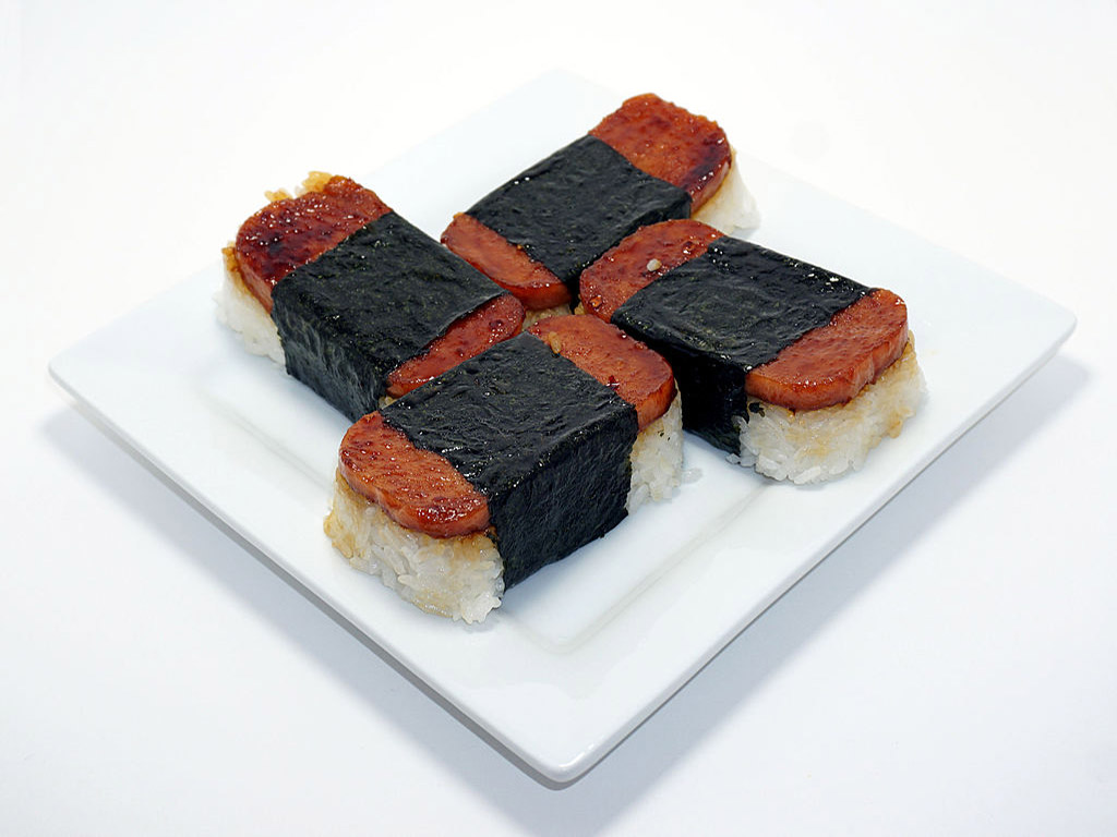 A plate of four freshly made Spam musubi.