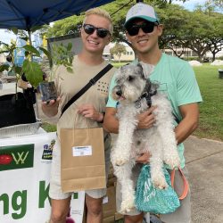 Participant posing with tomato seedling kit